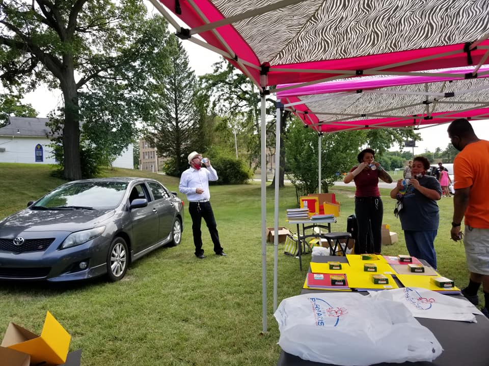 Setting up for Love Community Garden's Back to School Giveaway